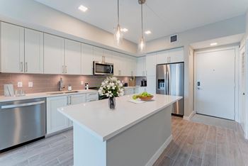 Kitchen with White Cabinets at Mayla Pompano, Pompano Beach, 33062